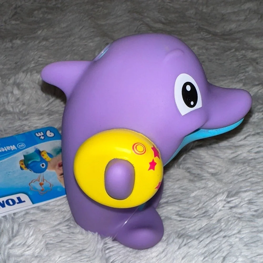 TOMY Water Whistlers Purple Dolphin Bath Toy E72379 Squirter Whistle 9m+